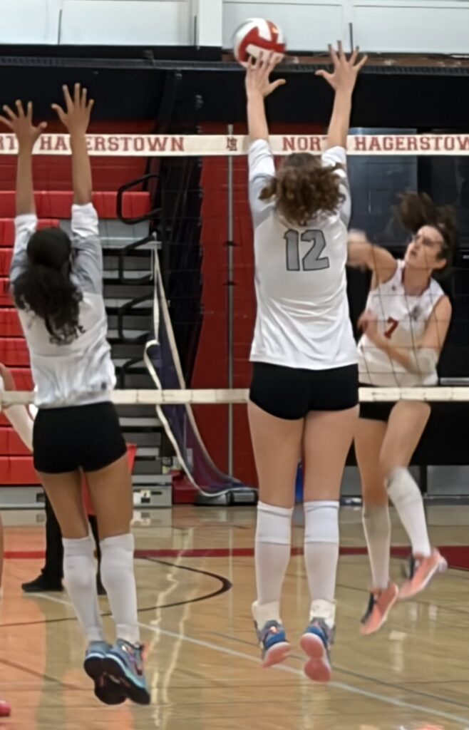 North Hagerstown's Khloe King unloads a kill through Oakdale's frontline defense.