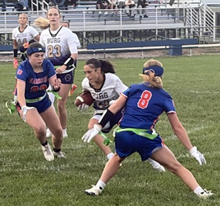 Smithsburg's Melyssa Bard makes a cut between Boonsboro defenders McKenna Johnson (23) and Lily Boyer (8) in the first half the Warriors' 22-20 win to remain undefeated.