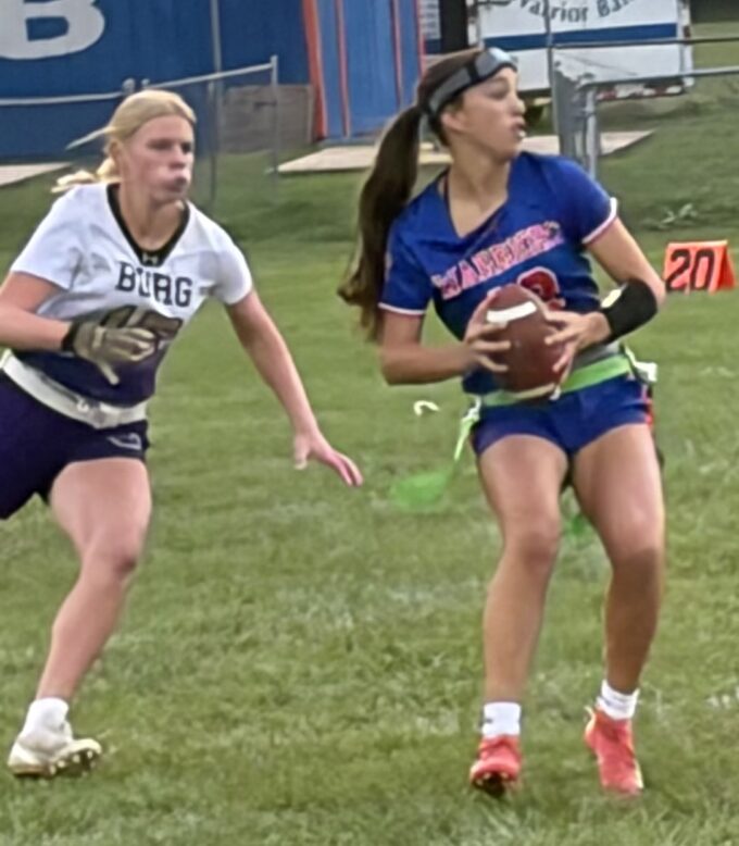 Smithsburg's Emmy Spithaler (15) charges from behind Boonsboro quarterback Mylee Hartman to try to prevent a pass in the first half of Boonsboro's 22-20 win