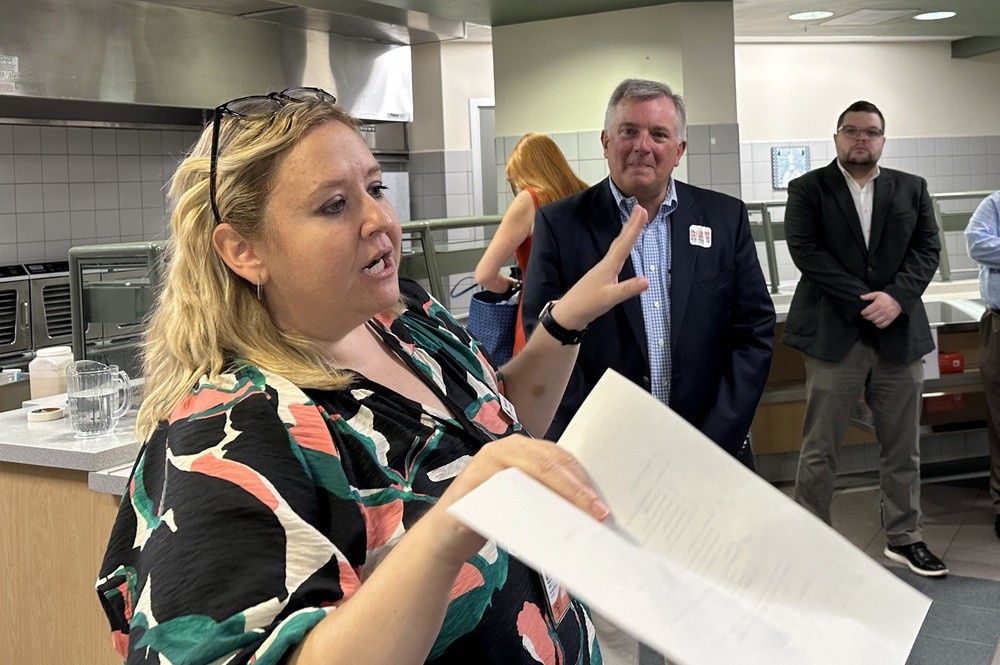 Maureen Kolb (left), Director of the Incubator Program, sharing how a student snack bar was turned into a Culinary Incubator, with Neil Bradley and Benton Anthony, representing Congresswoman April Delaney.